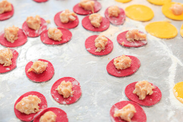 Dumplings on the metal surface of the culinary workshop. Background with selective focus and copy space