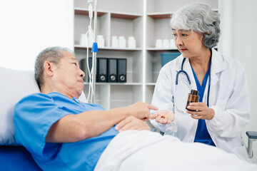 Medical doctor holing senior patient's hands and comforting her - obrazy, fototapety, plakaty
