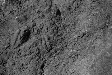 Weathered stone background. Black weathered rock.