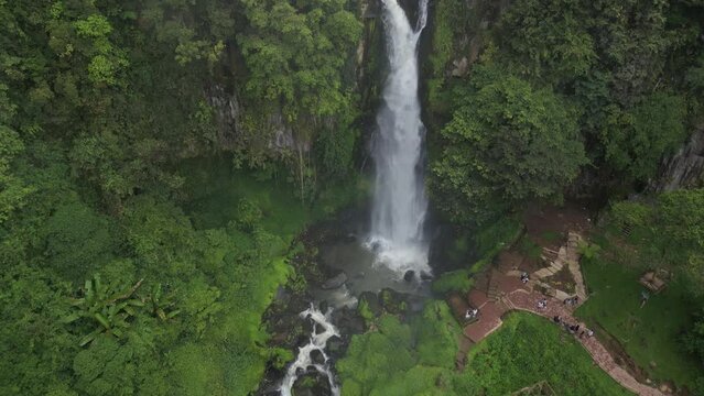 Aerial view of air terjun Sikulikap of Penatapan Forest at Berastagi, North Sumatera, Indonesia. Drone looking up shot reveals the beautiful nature.