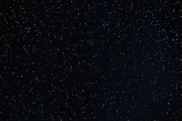 a high quality stock photograph of a single universe sky dark black with shiny stars