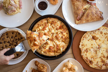 Top view, Pizza and other fast food on wooden table