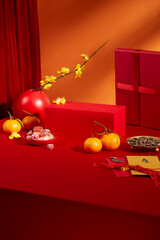 Tangerines, jam, sunflower seeds, lucky money envelopes, yellow apricot blossoms and red platform...