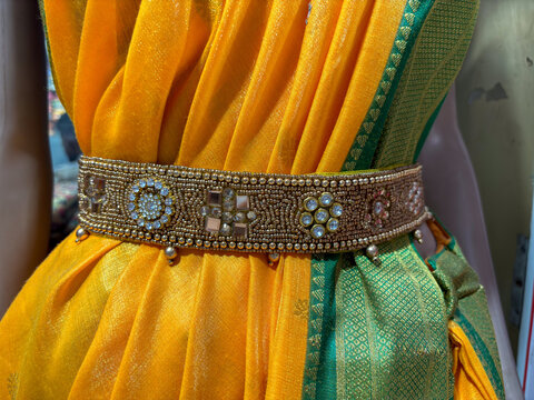 ​A woman wearing traditional sari with belly chain jewellery known as kamarband or kamarpatta