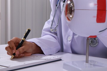 Close up of the ears of a professional female doctor in uniform taking notes in a notebook Medical...
