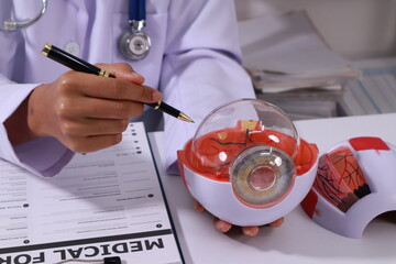 Close up of the ears of a professional female doctor in uniform taking notes in a notebook Medical...