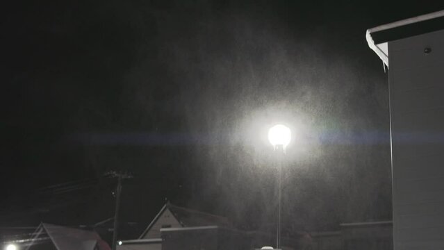 Hokkaido, Japan - December 23, 2023: Snow blown by strong wind in Biei, Hokkaido, Japan
