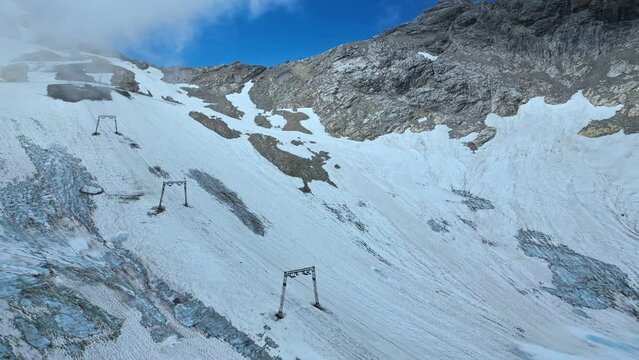 Cableway at famous ski destination at glacier mountain peak Zugspitze, melting glacier in the European Alps, Germany, Europe