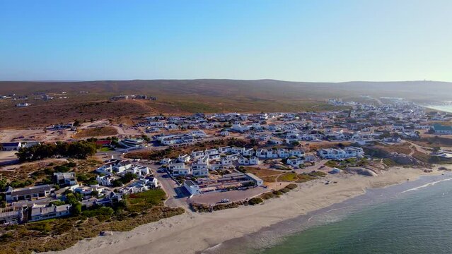 Scenic coastal village of Paternoster with whitewashed houses, Weskus, drone pan