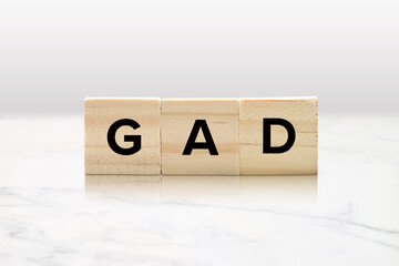 GAD Mental Health Concept on Wood Tiles - Generalized Anxiety Disorder