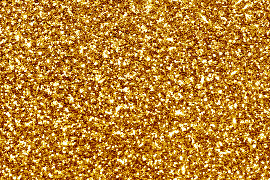 Gold glitter sparkle shining light texture background. New Year, Birthday, Anniversary, Christmas and Celebration background concept. 