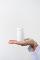 Specialist medical professionals check the quality and expiration date of the vials and medicine capsules.