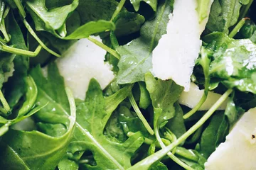 Fotobehang Healthy green salad with fresh arugula, parmesan cheese and olive oil © Nelli Kovalchuk