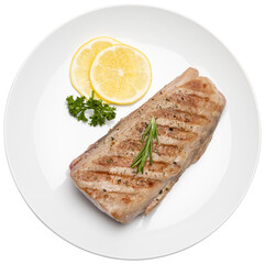 grilled cooked piece of tuna fillet on ceramic plate isolated