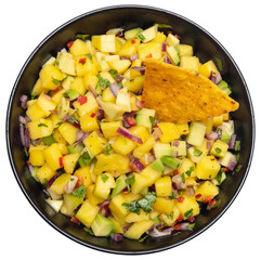 Freshly made mango salsa in a black ceramic bowl