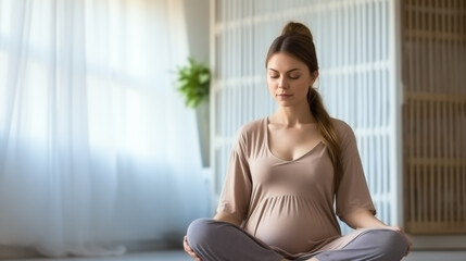 Fototapeta na wymiar Calm pregnant woman meditating while sitting in the lotus position at home. Spiritual and emotional concept of harmony in maternity time. Pregnant woman practicing yoga at home. Pilates pregnant woman