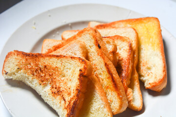 Toast with butter and sprinkle with sugar