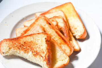 Toast with butter and sprinkle with sugar