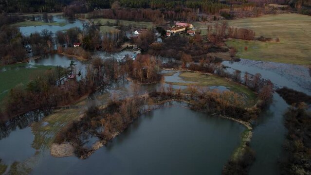 A flooded landscape with an old settlement. Drone. Spiled water. Europe.