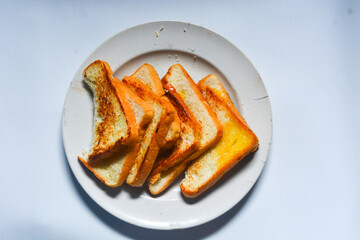 Toast with butter and sprinkle with sugar