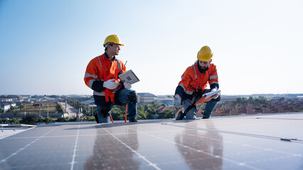 Engineering technician is professional trained in skills and techniques installing solar photovoltaic panels system on power industrial factory roof, Engineering concepts to good environment.