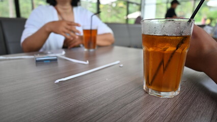 cold iced tea served in jumbo portions in transparent glass glasses