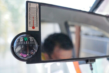 rearview mirror with built-in manual compass in the car