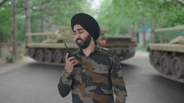 Angry Sikh Indian Army man giving shouting on walkie talkie