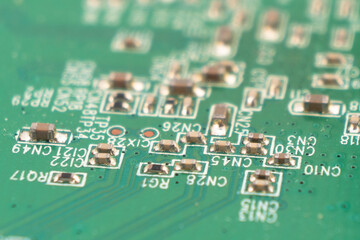 Macro shot of Circuit board with resistors microchips and electronic components background....