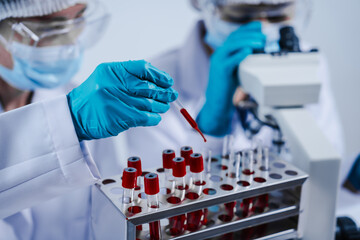Professional scientists in lab working with blood samples. to find components in blood Ideas for...