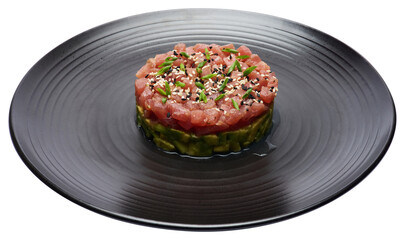 Tuna and avocado tartare on a dark ceramic plate