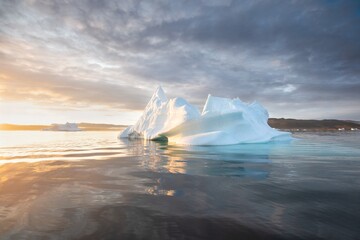 Melting icebergs by the coast of Greenland, on a beautiful summer day - Melting of a iceberg and pouring water into the sea. Global warming
Arctic nature landscape, Summer day