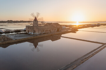 Sunset at Windmills in the salt evoporation pond in Marsala, Sicily island, Italy
Trapani salt flats and old windmill in Sicily.
View in beautifull sunny day.