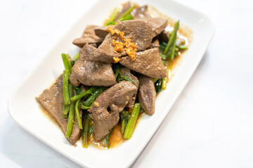 Stir fried pork liver with chinese celery.