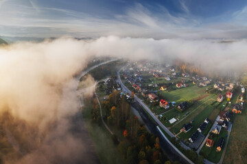 An aerial view of the autumn Pieniny Mountains captured on an October morning. Mists and low light...