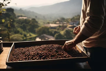 Foto op Plexiglas a man holding a wood tray of coffee beans in front of nature background bokeh style background © toonsteb