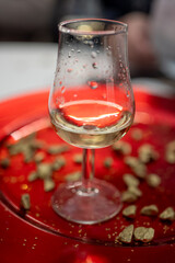 Small tasting glass of sparkling wine champagne on winter festival in December, Avenue de Champagne, Epernay, Champagne region, France