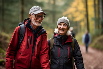 Fototapeta premium old couple hiking in the forest bokeh style background