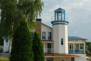 Building with a coastal lighthouse for observation. Modern lighthouse.