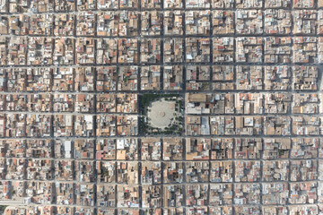 Symmetrically distributed city streets. Sunny day. View from the plane. Aerial view of Grammichele, a town near Catania, Sicily, Italy. 
