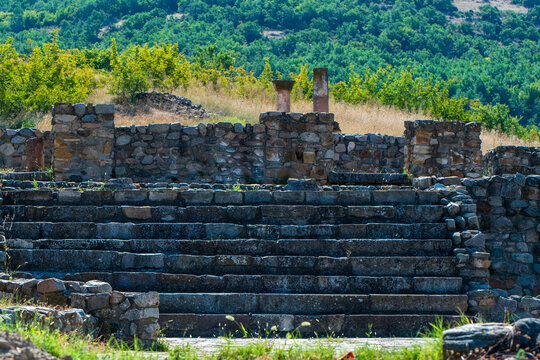 Staircase, made of stones. Columns, remains of the ancient town Bargala. Famous, Macedonian archaeological site. Near Shtip. Macedonia 2023.