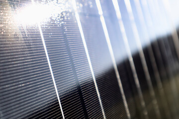 Abstract solar panels texture background with sunbeam reflection. Photovoltaic, alternative...