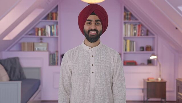 Happy Sikh Indian man smiling to the camera