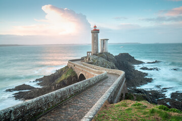 One of the most beautiful lighthouses at sunset. Phare de Petit Minou on the coast of Brittany, France, Europe