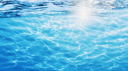 Fototapeta na wymiar Clear blue water surface with splashing ripples.