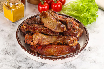 Roasted duck wings with sauce