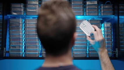 Person take a tin can from stacked cabinet of fish food
