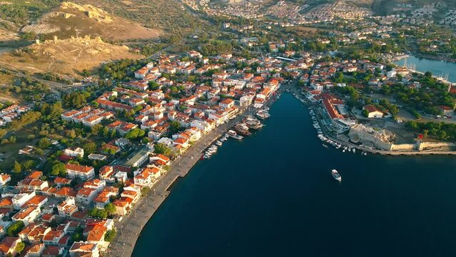 Sea bay with boats in Foca resort town in Turkey on Aegean sea coast. Aerial view
