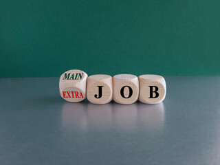Turned a wooden cube and changes concept red words Extra job to Main job. Beautiful green...