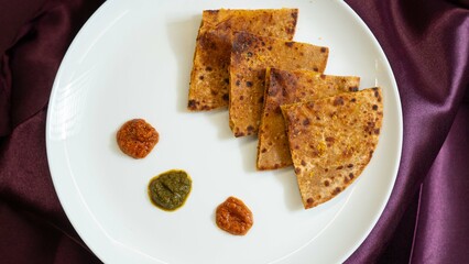 Indian Potato stuffed Flatbread. Aloo Paratha and Gobi Paratha Served with fresh curd and tomato...